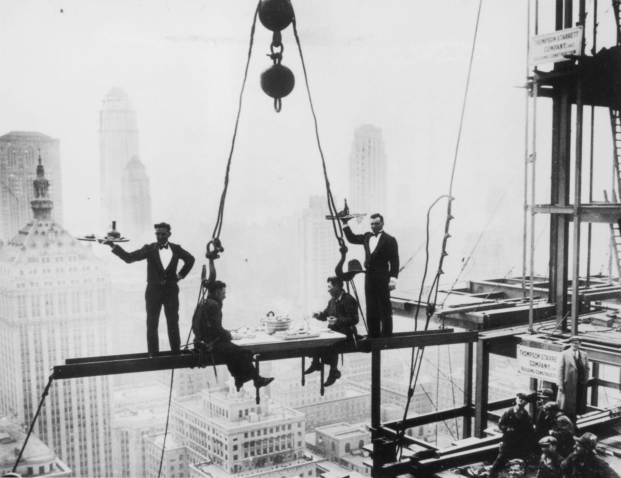 Eleven ironworkers eating lunch on a steel beam 840 feet above Manhattan — Lunch Atop a Skyscraper, 1932