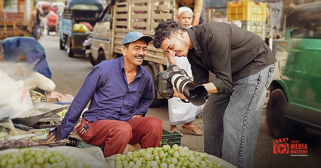 LMM student photographing a subject at a local market – real-world photography training