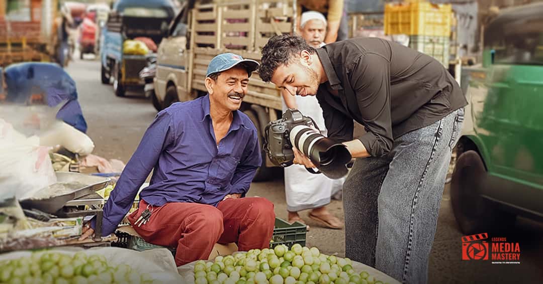 LMM student photographing a subject at a local market – real-world photography training